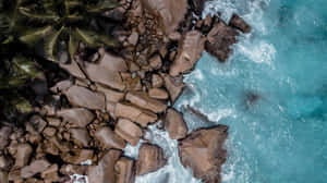 Aerial Rocks Beach Formations Waves Wallpaper