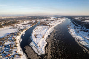 Aerial View Of Snowy Town In Lithuania Wallpaper