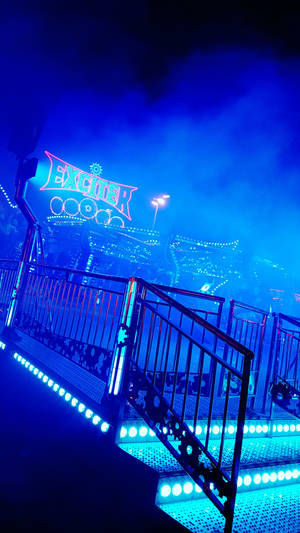 Aesthetic Blue Amusement Park Ride Wallpaper