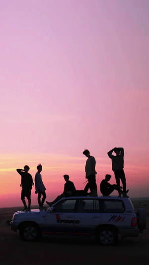 Aesthetic Bts Silhouette On Pink Skies Wallpaper