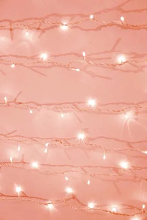 Aesthetic Peach Pink Christmas Lights Wallpaper