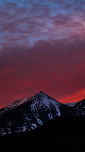 Aesthetic Snowy Mountains Sunset Portrait Wallpaper