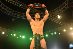 Aew Star Sammy Guevara Triumphantly Holding A Championship Belt Wallpaper