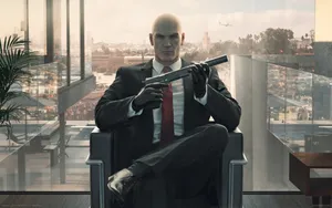 Agent 47 From The Hitman Series In A Black Suit Wallpaper
