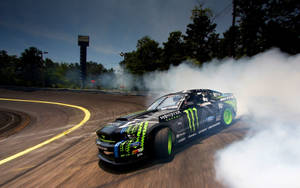 Agile Monster Drift Car In High-velocity Action Wallpaper