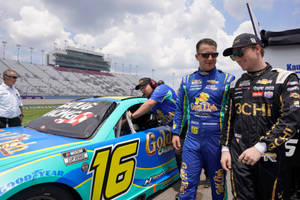 Aj Allmendinger And Noah Cragson Striking A Pose In Racing Attire Wallpaper