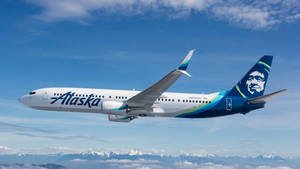 Alaska Airlines Flying On Blue Skies Wallpaper