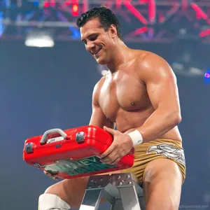 Alberto Del Rio Celebrating Victory With Money In The Bank Suitcase Wallpaper