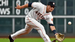 Alex Bregman Crouching Down To Catch Ball Wallpaper