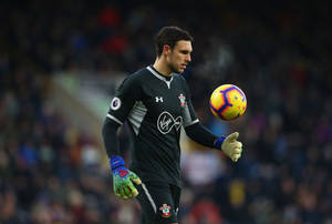 Alex Mccarthy Tossing A Soccer Ball Wallpaper