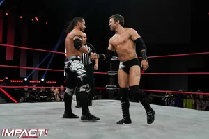 Alex Shelley Shaking Hands With Chris Sabin Wallpaper