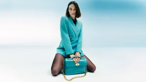 Alexa Chung Teal Ensemblewith Handbag Wallpaper