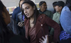 Alexandria Ocasio-cortez In A Leather Jacket Wallpaper