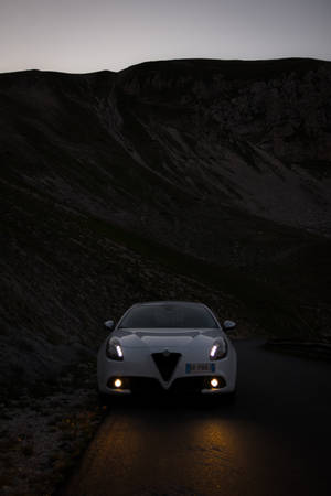 Alfa Romeo Giulietta Illuminated At Night Wallpaper