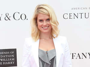 Alice Eve Posing In Elegant Attire Wallpaper