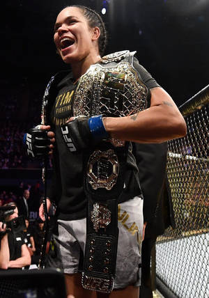 Amanda Nunes Happy With Belts Wallpaper