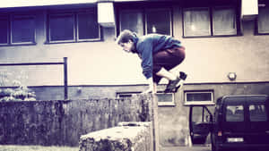 Amateur Traceur Doing Parkour Wallpaper