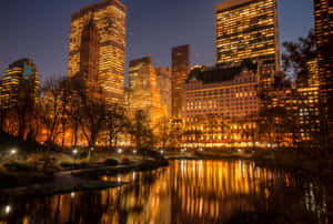 Amazing Night Skyline Of A Modern City. Wallpaper