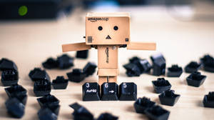 Amazon Boxman With Keyboard Keys Wallpaper