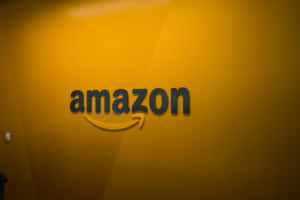 Amazon Uk Logo In Yellow-orange Wall Wallpaper