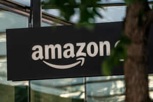 Amazon Uk Sign Near Tree Wallpaper