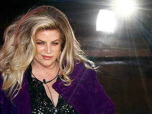 American Actress Kirstie Alley On A Spotlight Wallpaper