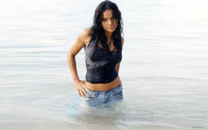 American Actress Michelle Rodriguez At The Beach Wallpaper