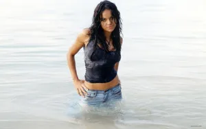American Actress Michelle Rodriguez At The Beach Wallpaper