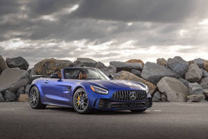 Amg Gtr Against Rock Formations Wallpaper