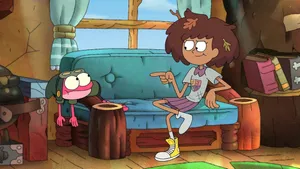 Amphibia Anne And Sprig On Couch Wallpaper