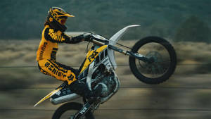 An Adrenaline-pumping Ride With Fox Dirt Bike Wallpaper