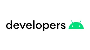 An Enthusiastic Android Developer Programming On Their Laptop. Wallpaper