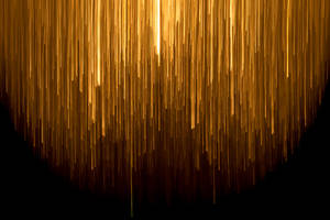 An Ethereal Image Of A Gold-colored Rain On A Glitchy Backdrop Wallpaper