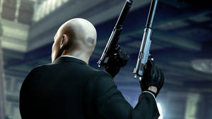 An Experienced Hitman Ready To Complete Any Task Wallpaper