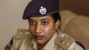 An Image Of A Female Officer Wearing A Cap With An Ips Logo. Wallpaper