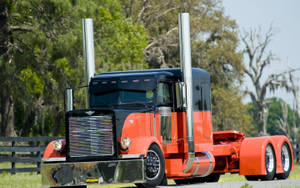 An Orange Peterbilt Truck Wallpaper