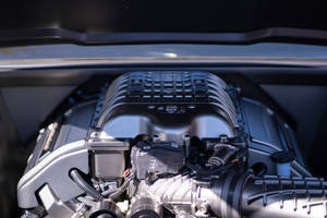 An Up-close Look At A Black And Silver Car Engine Wallpaper