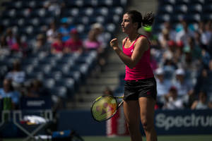 Anastasija Sevastova In Action During A Tennis Match. Wallpaper