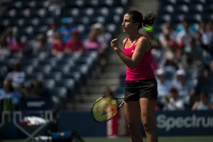 Anastasija Sevastova In Action During A Tennis Match. Wallpaper