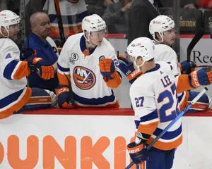 Anders Lee, An Influential Hockey Player, Sharing A Moment With His Bench Teammates. Wallpaper