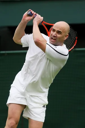 Andre Agassi In White Tennis Outfit Wallpaper