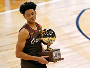 Anfernee Simons Holding Trophy Court Wallpaper