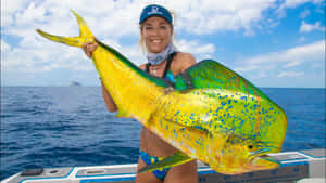 Anglerwith Caught Mahi Mahi Wallpaper