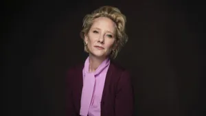 Anne Heche In Pink And Maroon Suit Wallpaper