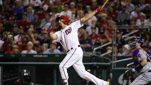 Anthony Rendon Running While Holding A Bat Wallpaper