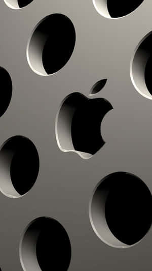 Apple Logo On A Metal Surface With Holes Wallpaper