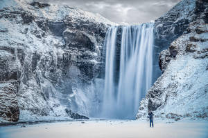 Arctic Waterfall In Powdery Snow Wallpaper