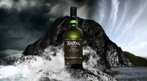 Ardbeg An Oa Whisky In Ocean Waves Wallpaper