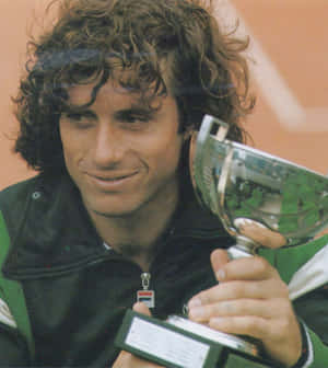 Argentine Professional Guillermo Vilas Tennis Player Champion Thropy Wallpaper