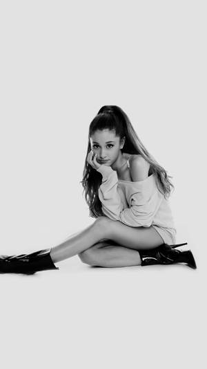 Ariana Grande Rocks Stylish Black Boots Wallpaper